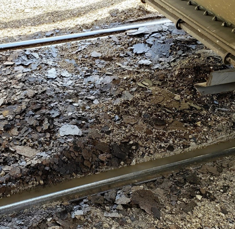 Photo of railcar rust that was powerwashed off to clear contaminants
